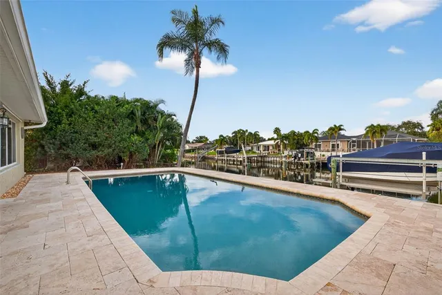 a view of a swimming pool with a lounge chair