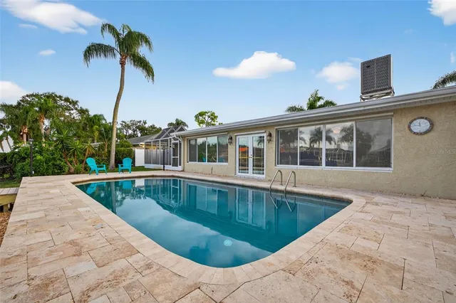 a view of a swimming pool with a deck
