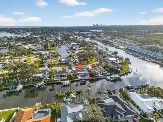 an aerial view of residential building with outdoor space and lake view