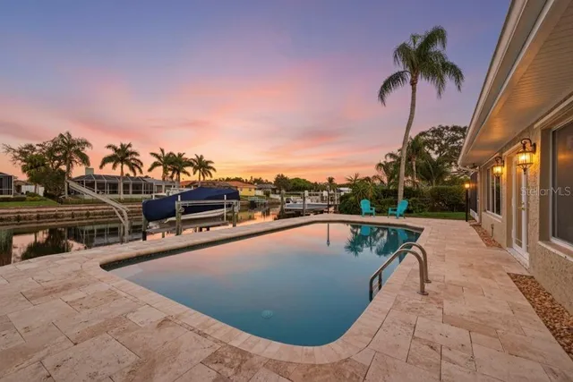 a view of a swimming pool with a lounge chair