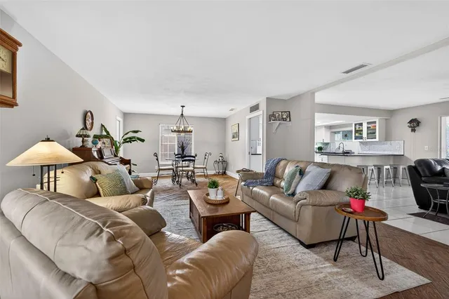 a living room with furniture and a lamp