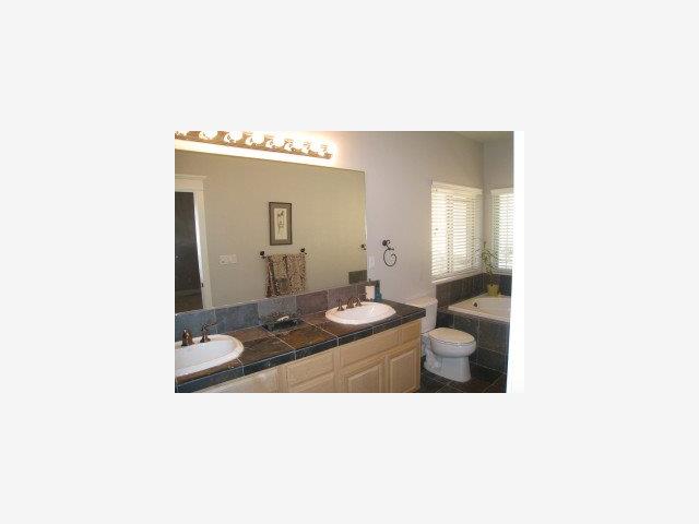 529 Sunrise Road Copperopolis, CA 95228 - Photo 5 of 9 a living room with a couch and a mirror