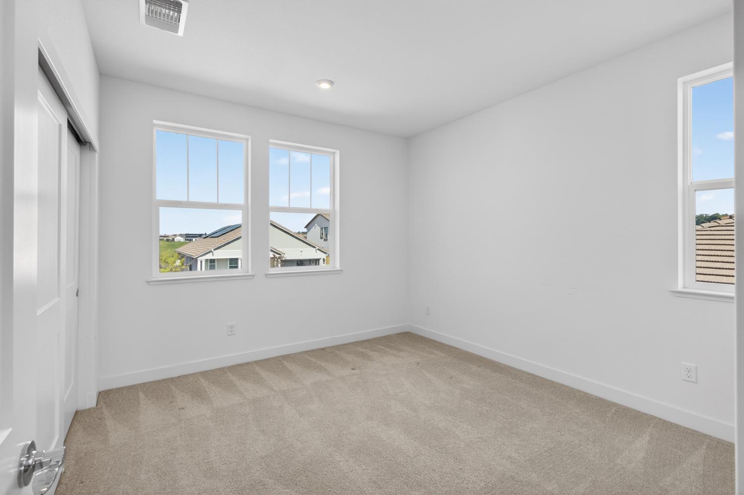 2883 Ridgecrest Drive Lincoln, CA 95648 - Photo 27 of 42 an empty room with windows