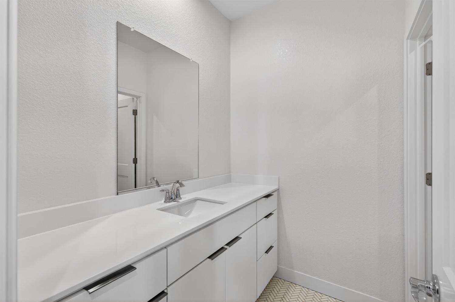 2883 Ridgecrest Drive Lincoln, CA 95648 - Photo 29 of 42 a bathroom with a sink and a mirror