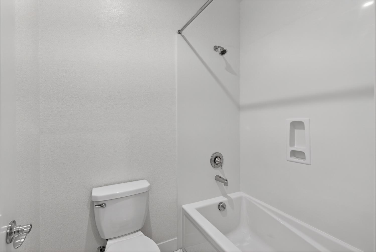 2883 Ridgecrest Drive Lincoln, CA 95648 - Photo 30 of 42 a white bath tub sitting next to a white toilet