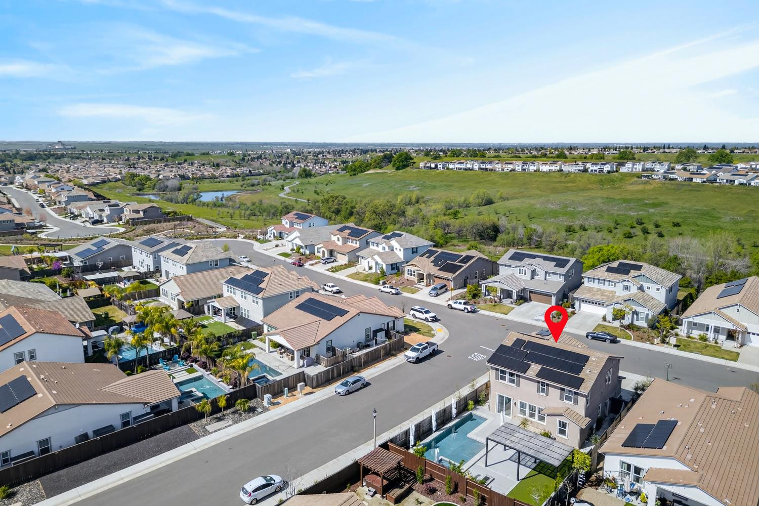 2883 Ridgecrest Drive Lincoln, CA 95648 - Photo 36 of 42 an aerial view of a city with lots of residential buildings and ocean view in back