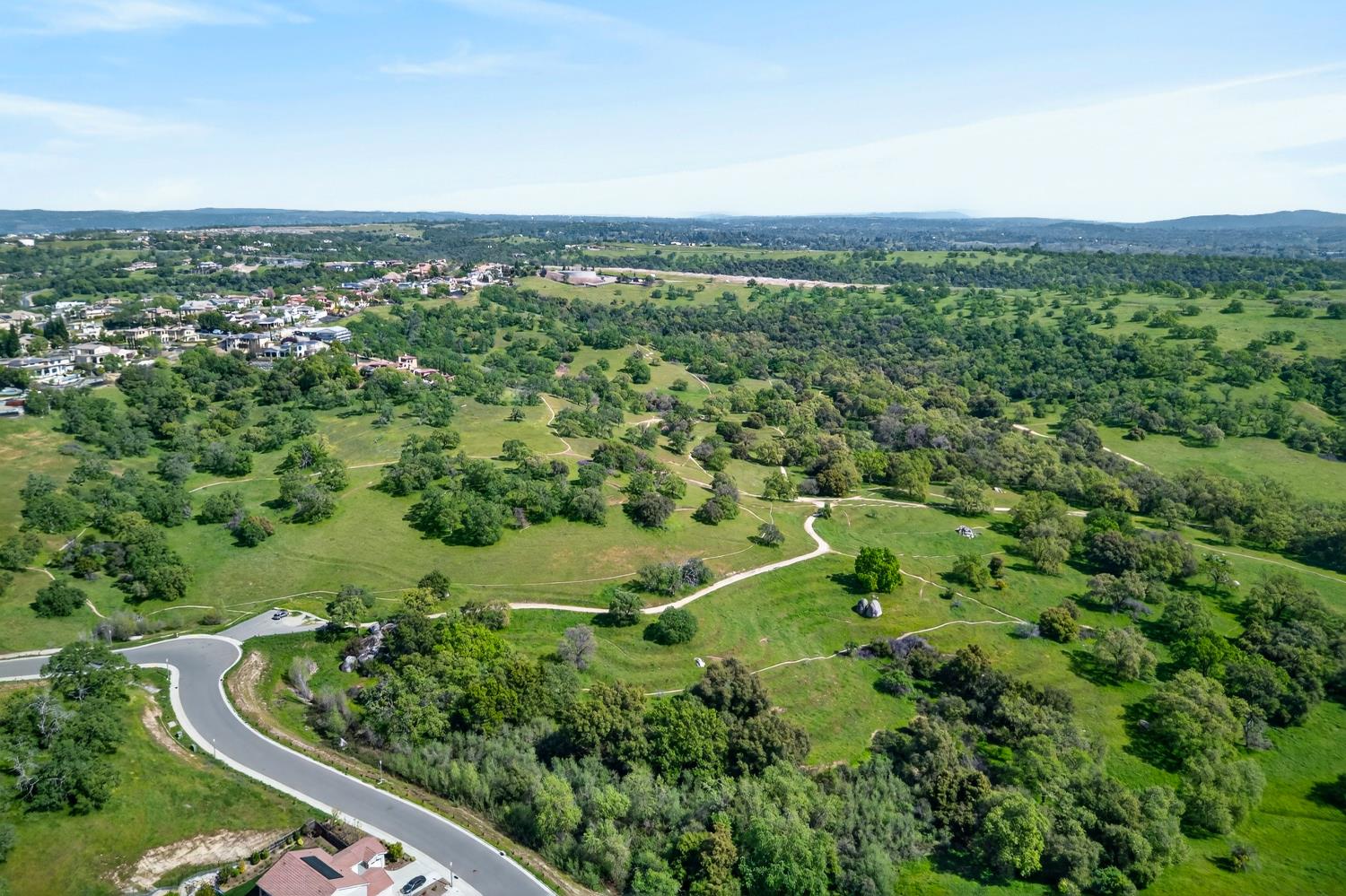 2883 Ridgecrest Drive Lincoln, CA 95648 - Photo 37 of 42 an aerial view of green landscape with trees houses and mountain view