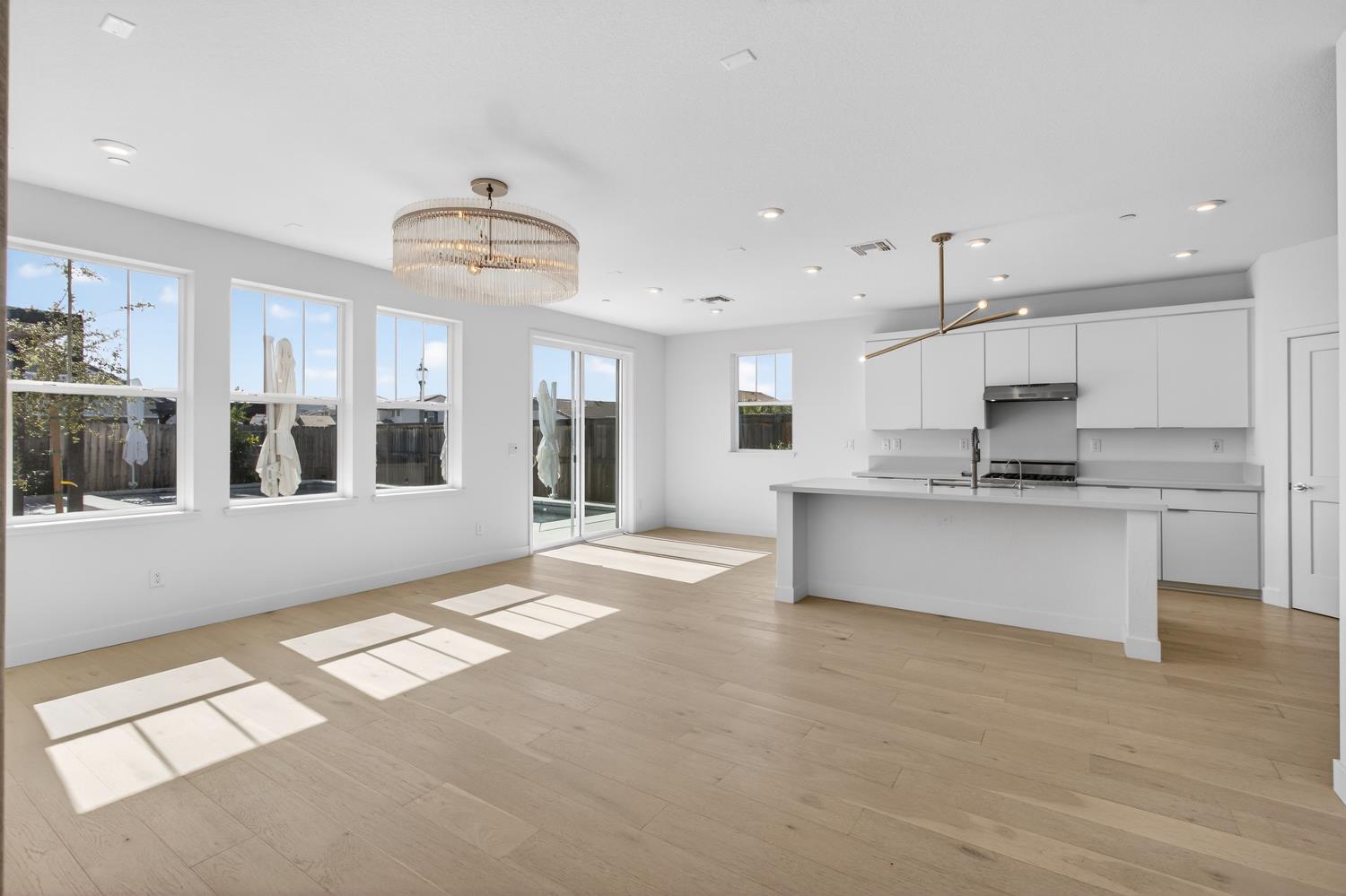 2883 Ridgecrest Drive Lincoln, CA 95648 - Photo 7 of 42 a large kitchen with stainless steel appliances kitchen island granite countertop a large counter top and a stove top oven