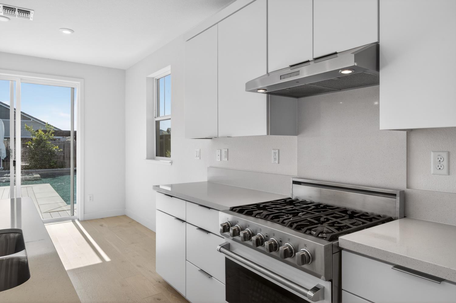 2883 Ridgecrest Drive Lincoln, CA 95648 - Photo 9 of 42 a kitchen with granite countertop a stove and a sink