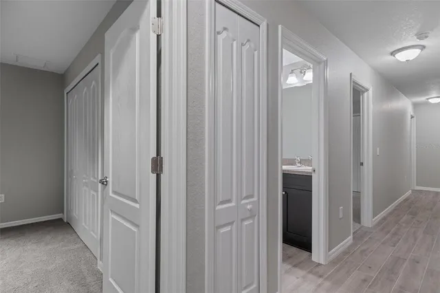 a bathroom with a granite countertop sink a toilet and a bathtub