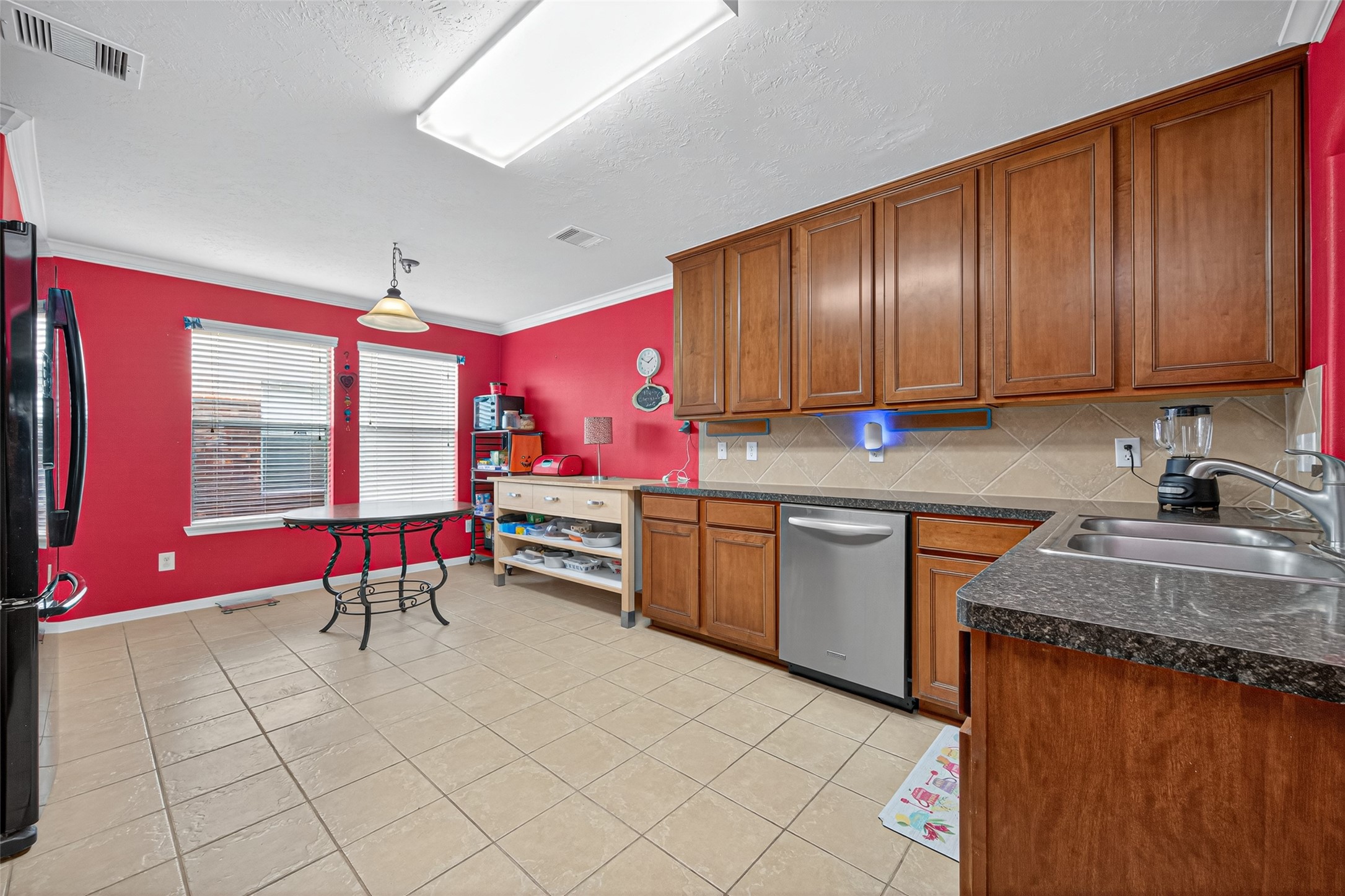 22402 Bridgestone Ridge Drive Spring, TX 77389 - Photo 14 of 49 a kitchen with stainless steel appliances granite countertop a stove sink and cabinets