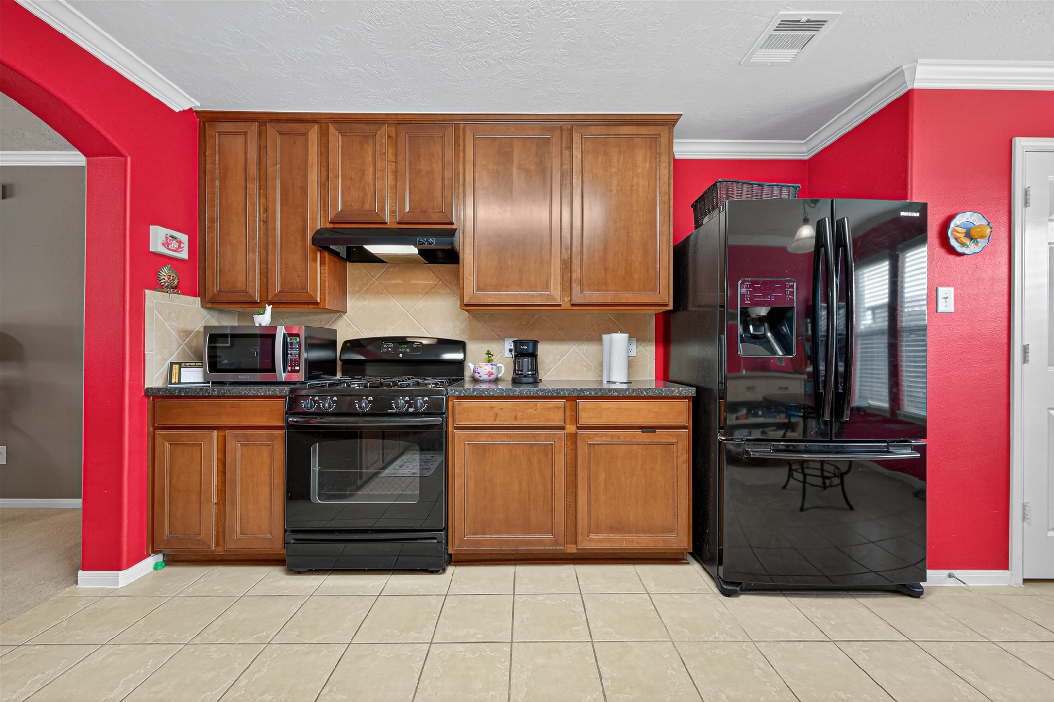 22402 Bridgestone Ridge Drive Spring, TX 77389 - Photo 17 of 49 a kitchen with stainless steel appliances granite countertop a stove top oven