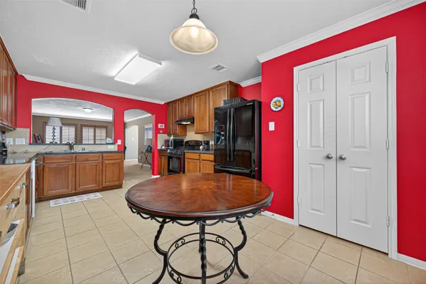 a view of a kitchen and dining area in the house