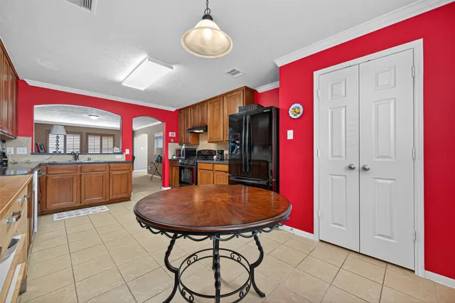 a view of a kitchen and dining area in the house
