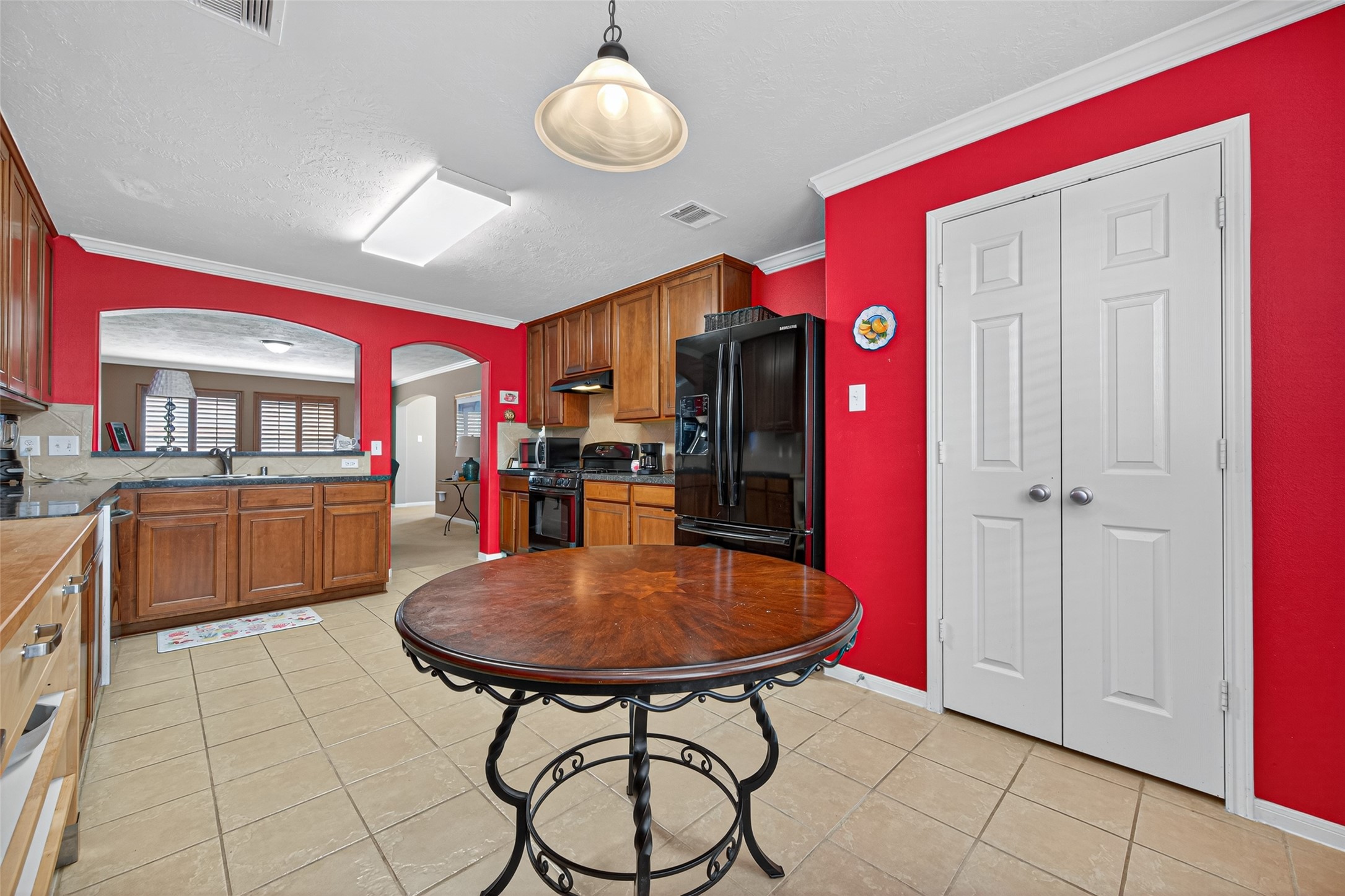 22402 Bridgestone Ridge Drive Spring, TX 77389 - Photo 20 of 49 a view of a kitchen and dining area in the house