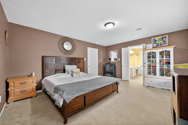 a bedroom with a bed and a cabinets