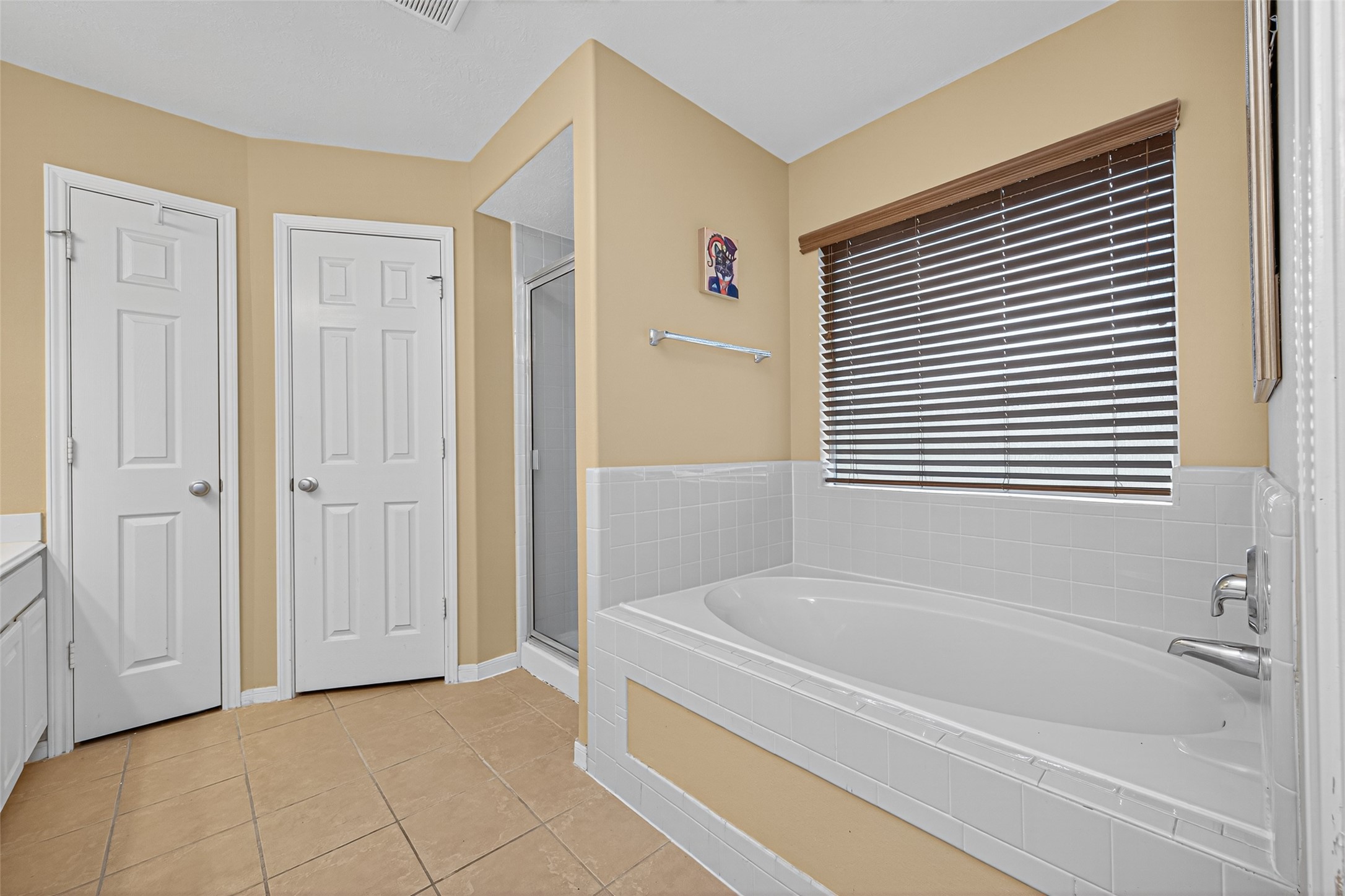 22402 Bridgestone Ridge Drive Spring, TX 77389 - Photo 27 of 49 a bathroom with a bathtub and a shower