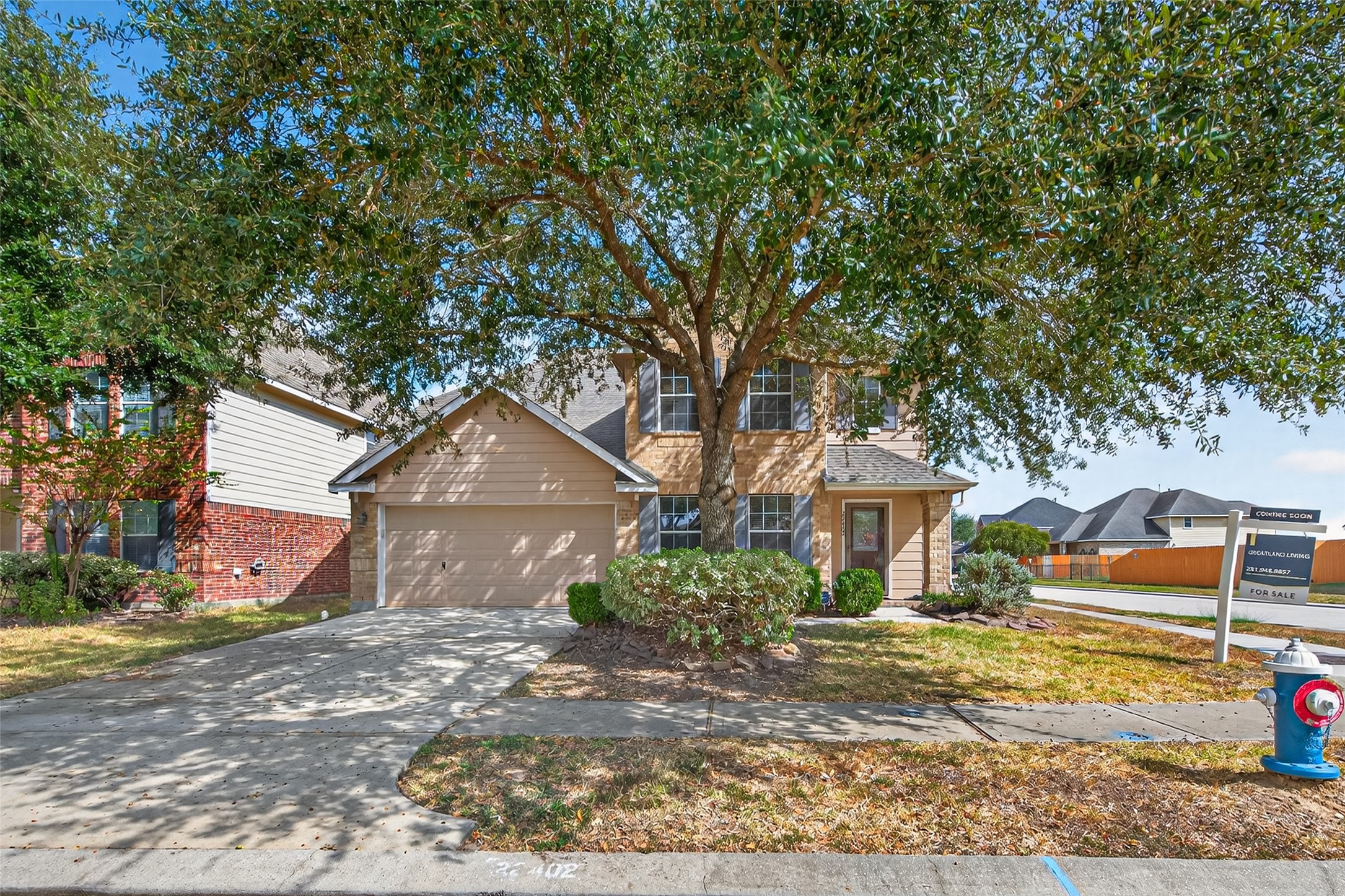 22402 Bridgestone Ridge Drive Spring, TX 77389 - Photo 3 of 49 a front view of a house with a yard and garage