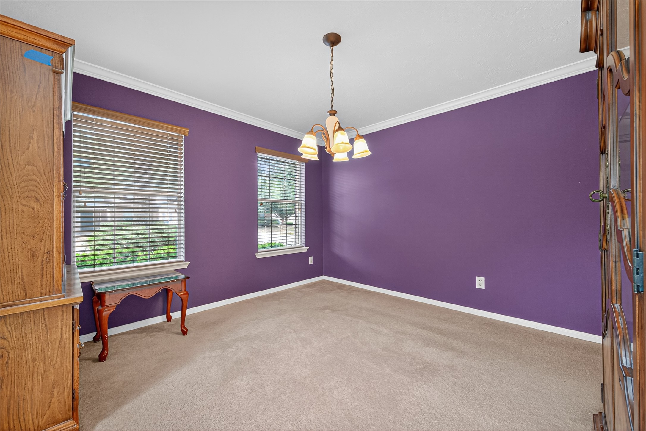 22402 Bridgestone Ridge Drive Spring, TX 77389 - Photo 32 of 49 a room with windows and chandelier