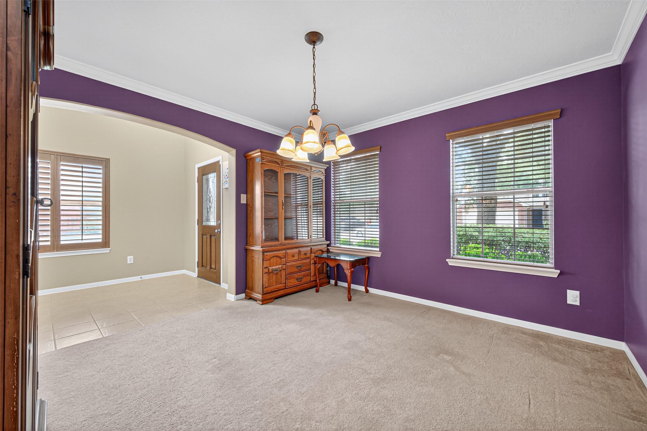 22402 Bridgestone Ridge Drive Spring, TX 77389 - Photo 33 of 49 a living room with furniture and a chandelier