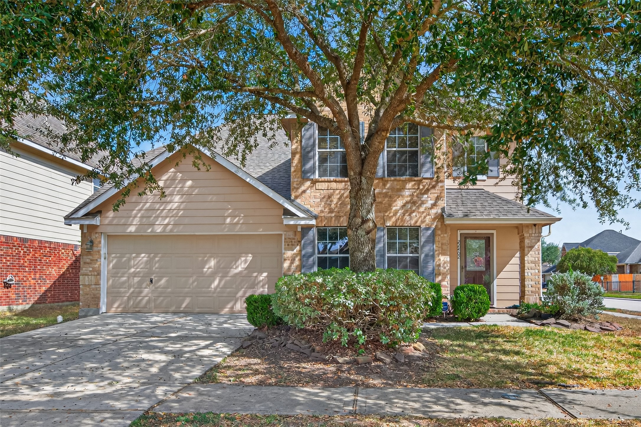 22402 Bridgestone Ridge Drive Spring, TX 77389 - Photo 4 of 49 a front view of a house with a yard and garage