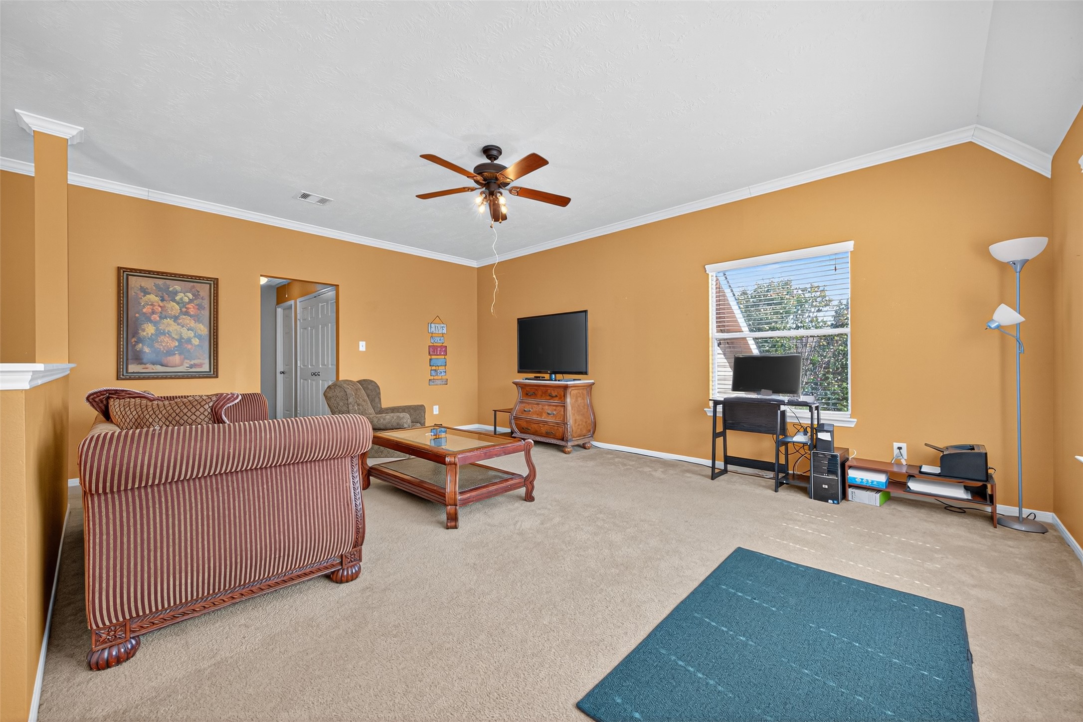 22402 Bridgestone Ridge Drive Spring, TX 77389 - Photo 41 of 49 a living room with furniture and a flat screen tv