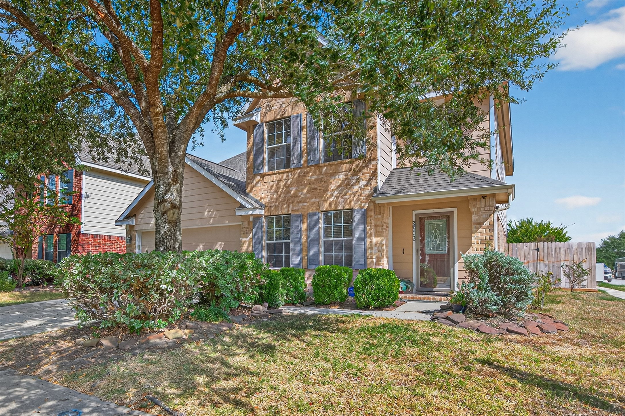 22402 Bridgestone Ridge Drive Spring, TX 77389 - Photo 5 of 49 front view of a house with a tree