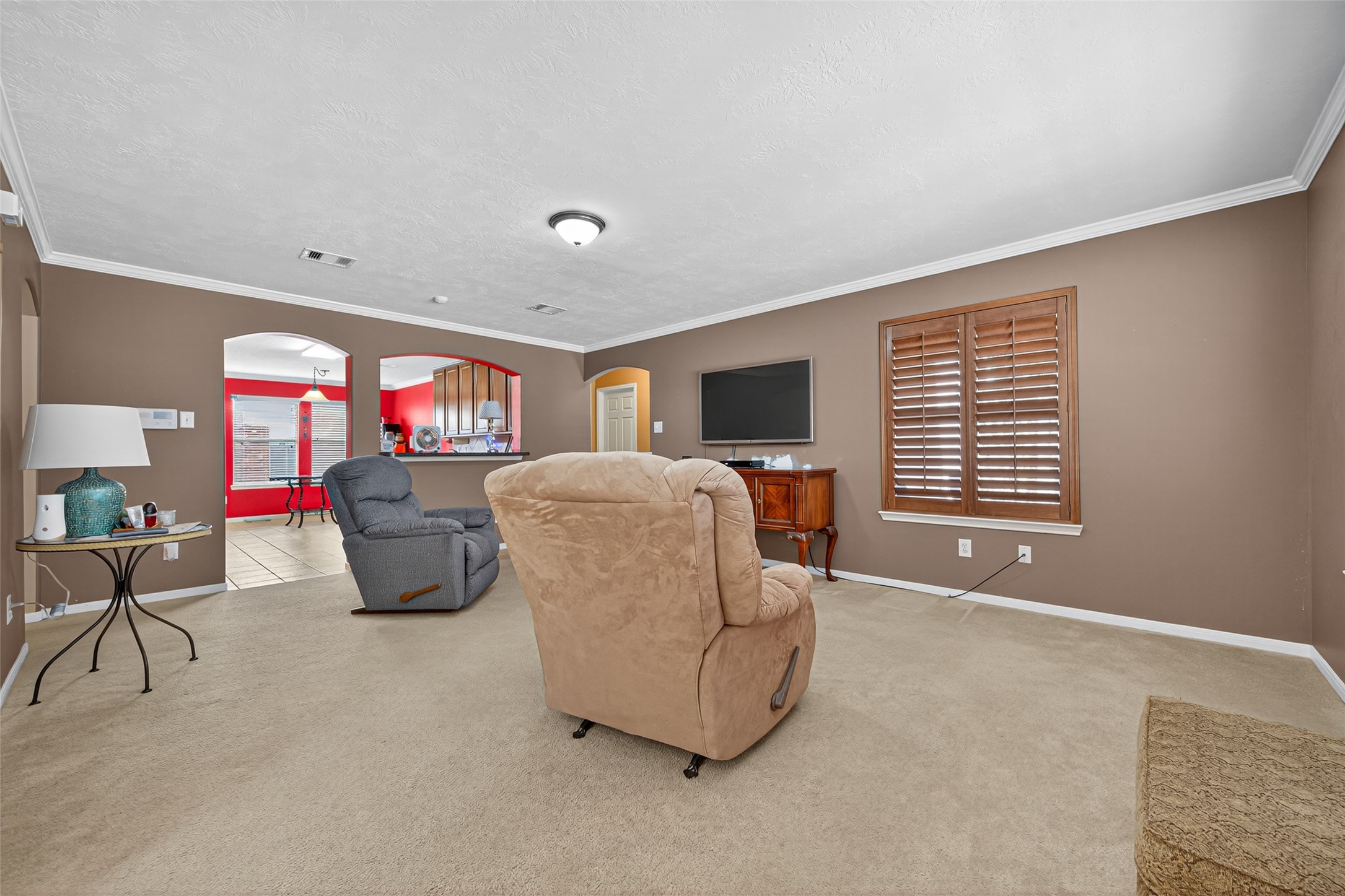 22402 Bridgestone Ridge Drive Spring, TX 77389 - Photo 9 of 49 a living room with furniture and a flat screen tv