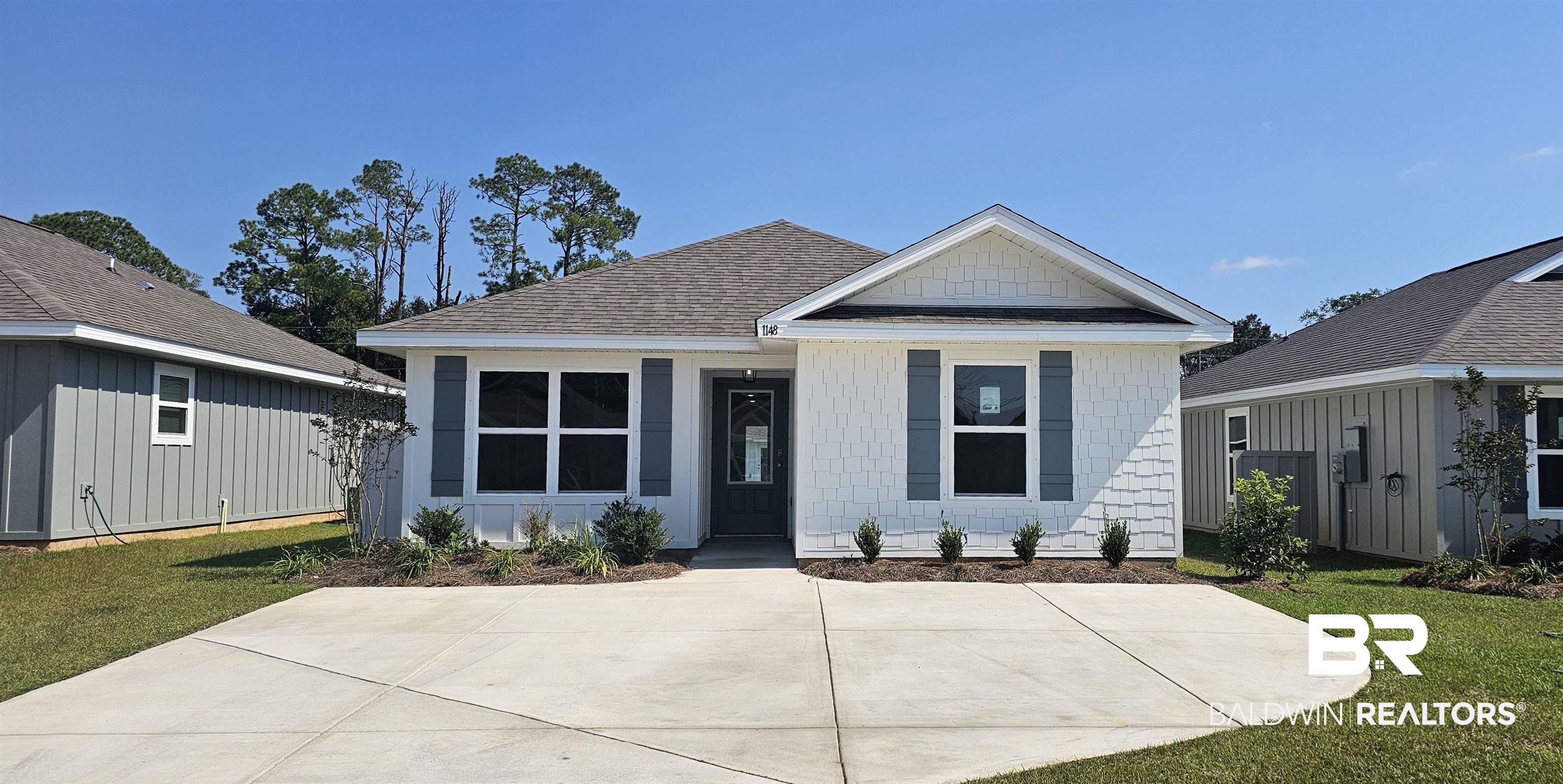 1148 Sweet Laurel Street Foley, AL 36535 - Photo 1 of 18 View of front of house featuring a front lawn