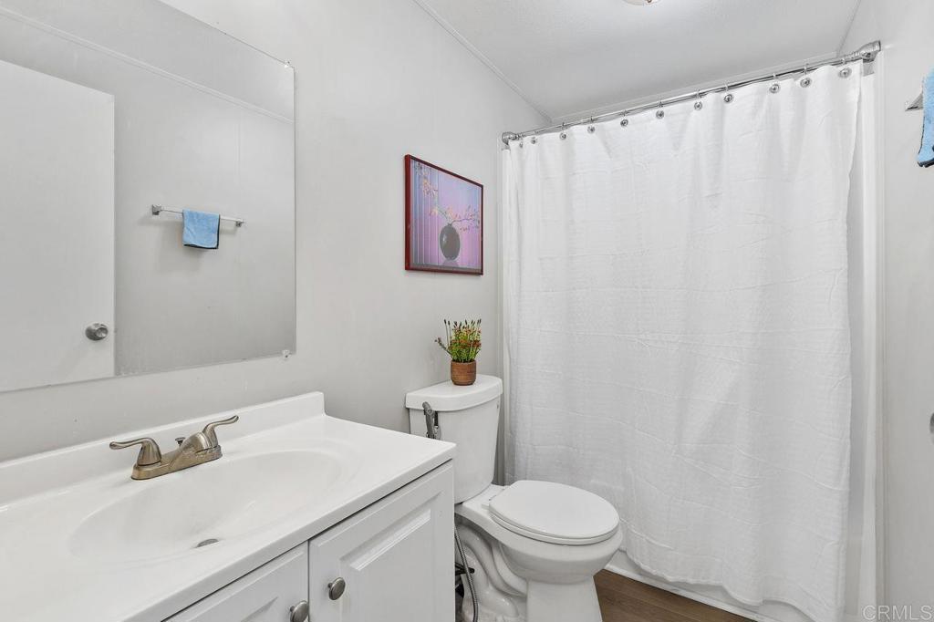 530 West Devonshire Avenue, Unit 84 Hemet, CA 92543 - Photo 27 of 36 a bathroom with a sink and a toilet