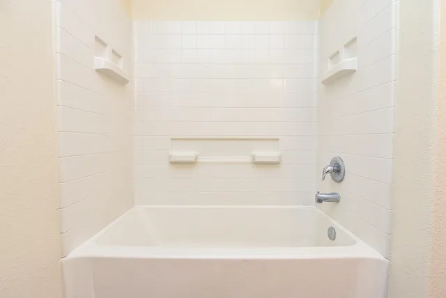 a close up of a bathtub in a bathroom