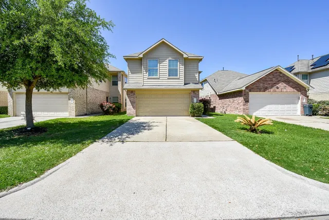 a front view of a house with yard