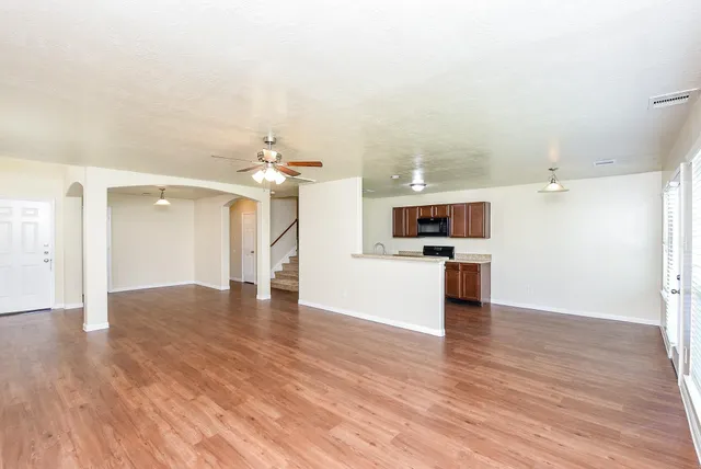 a view of a kitchen with a sink and a kitchen area