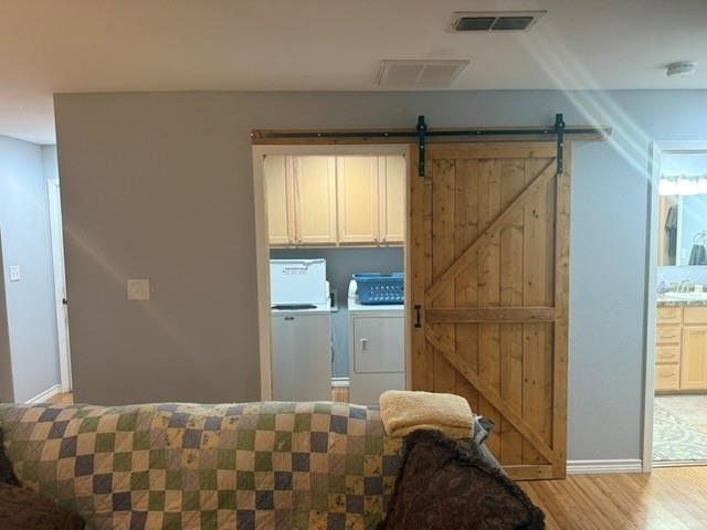 1387 Hickory Street Rhome, TX 76078 - Photo 35 of 36 Barndominium - Laundry room with barn door entry.