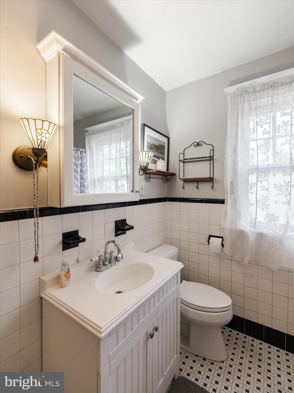 441 Cricket Avenue Glenside, PA 19038 - Photo 17 of 28 a bathroom with a sink toilet and mirror