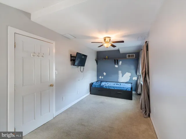a view of living room with furniture and lamp