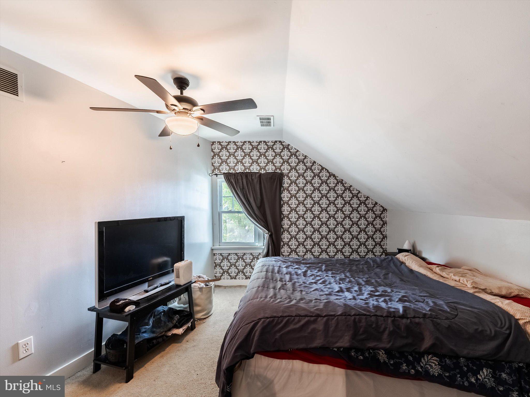 441 Cricket Avenue Glenside, PA 19038 - Photo 23 of 28 a bedroom with a bed window and a flat screen tv