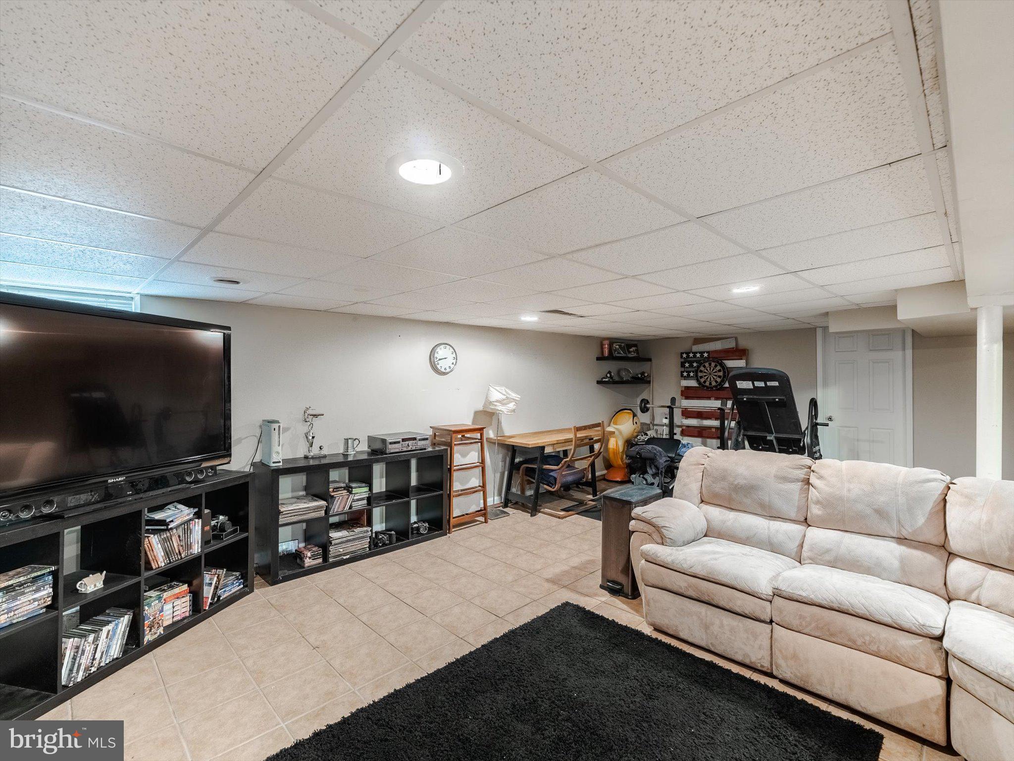 441 Cricket Avenue Glenside, PA 19038 - Photo 26 of 28 a living room with furniture and a flat screen tv