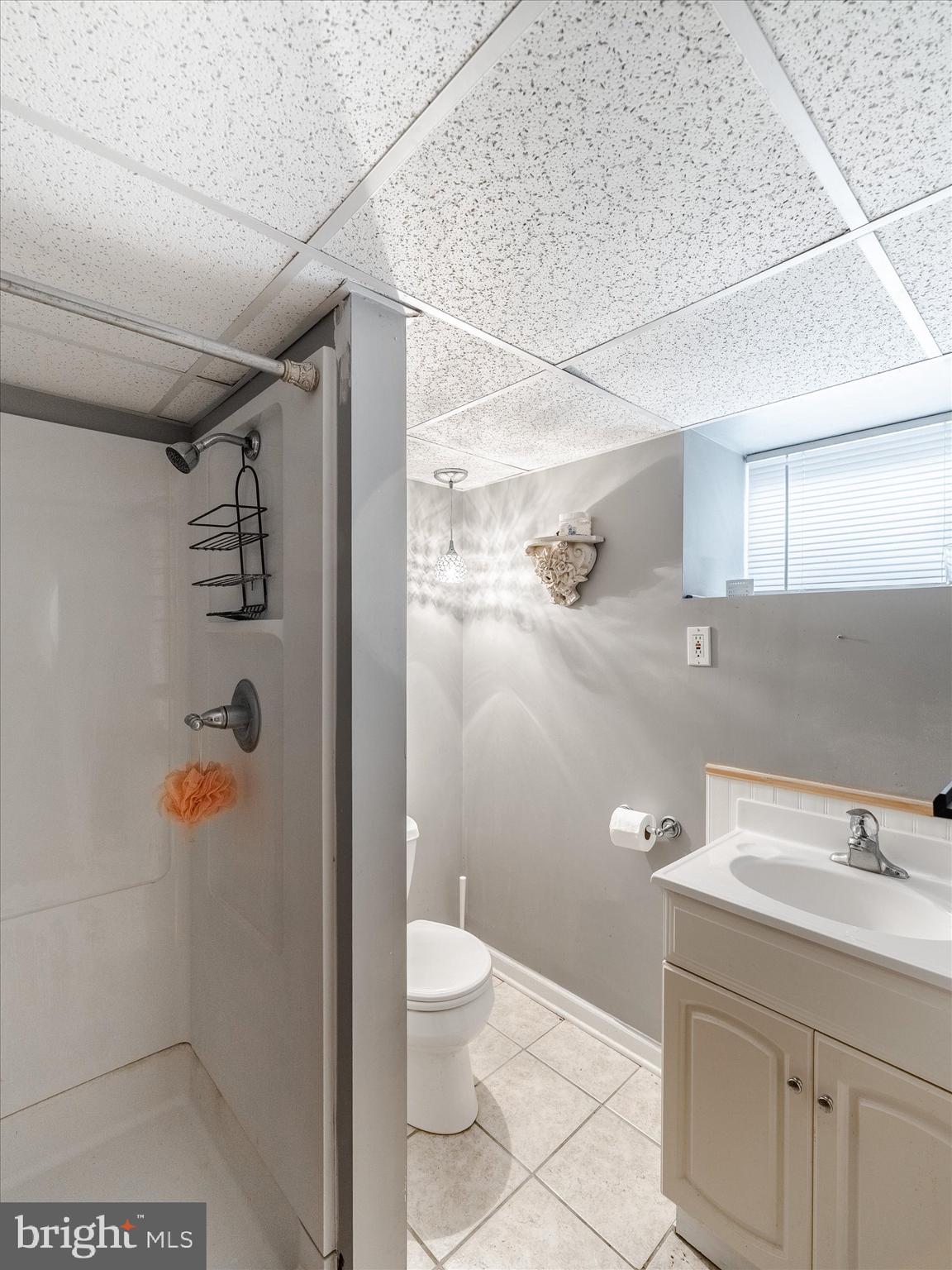 441 Cricket Avenue Glenside, PA 19038 - Photo 27 of 28 a bathroom with a granite countertop sink a toilet and shower