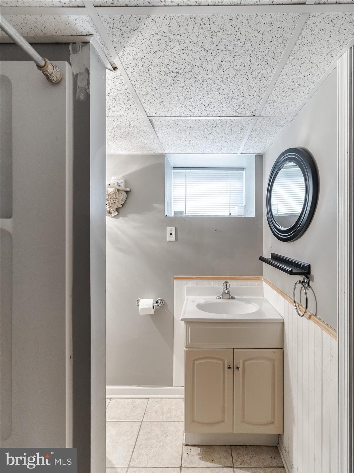 441 Cricket Avenue Glenside, PA 19038 - Photo 28 of 28 a bathroom with a sink vanity granite and a mirror