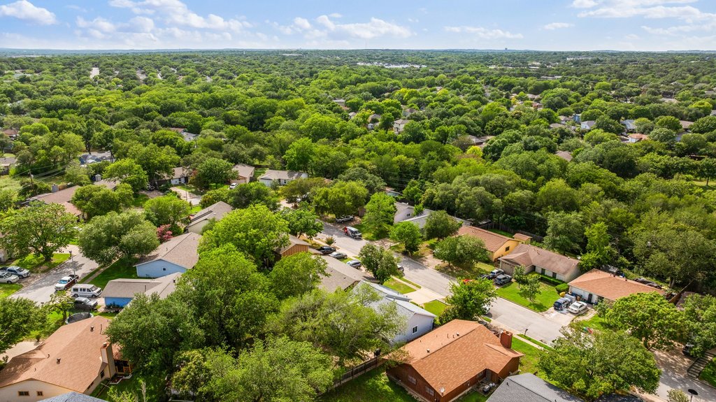 658 Mairo Street Austin, TX 78748 - Photo 35 of 40 Aerial view showcasing a residential community nestled among mature, vibrant green trees.