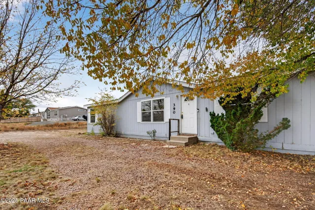 a house with a tree in front of it