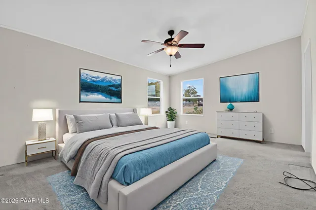 a view of a house with a yard and potted plants