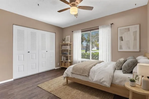 a bedroom with a bed and window
