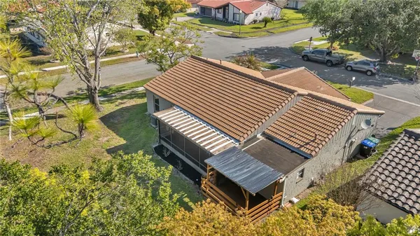 an aerial view of residential houses with outdoor space