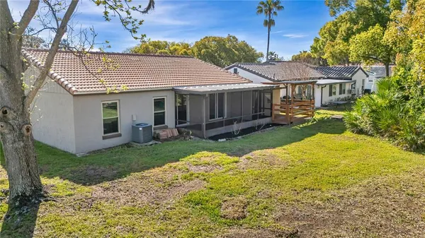 an aerial view of a house with a garden and swimming pool