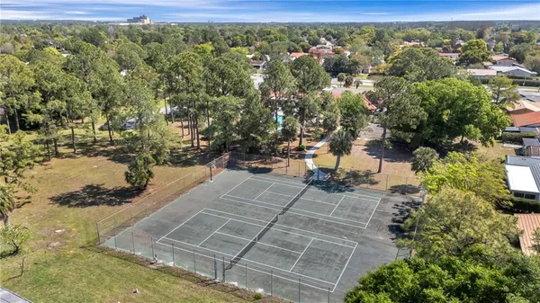 a view of a house with garden and a sitting area
