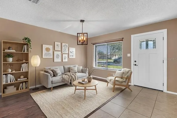 a living room with furniture and a window