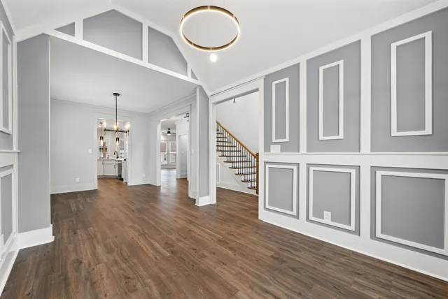 a view of an entryway with wooden floor