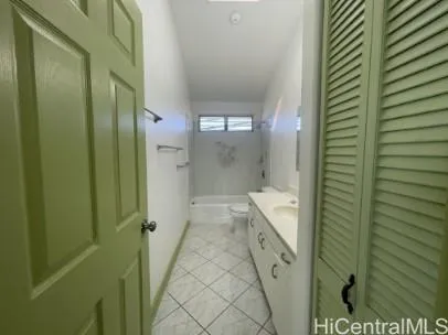 a view of an empty room and wooden floor